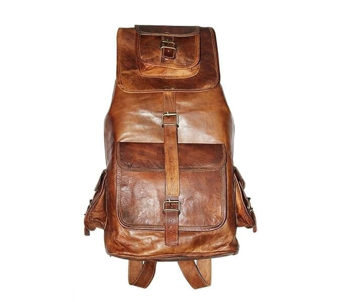 A vintage brown leather backpack with front pockets and brass buckles.