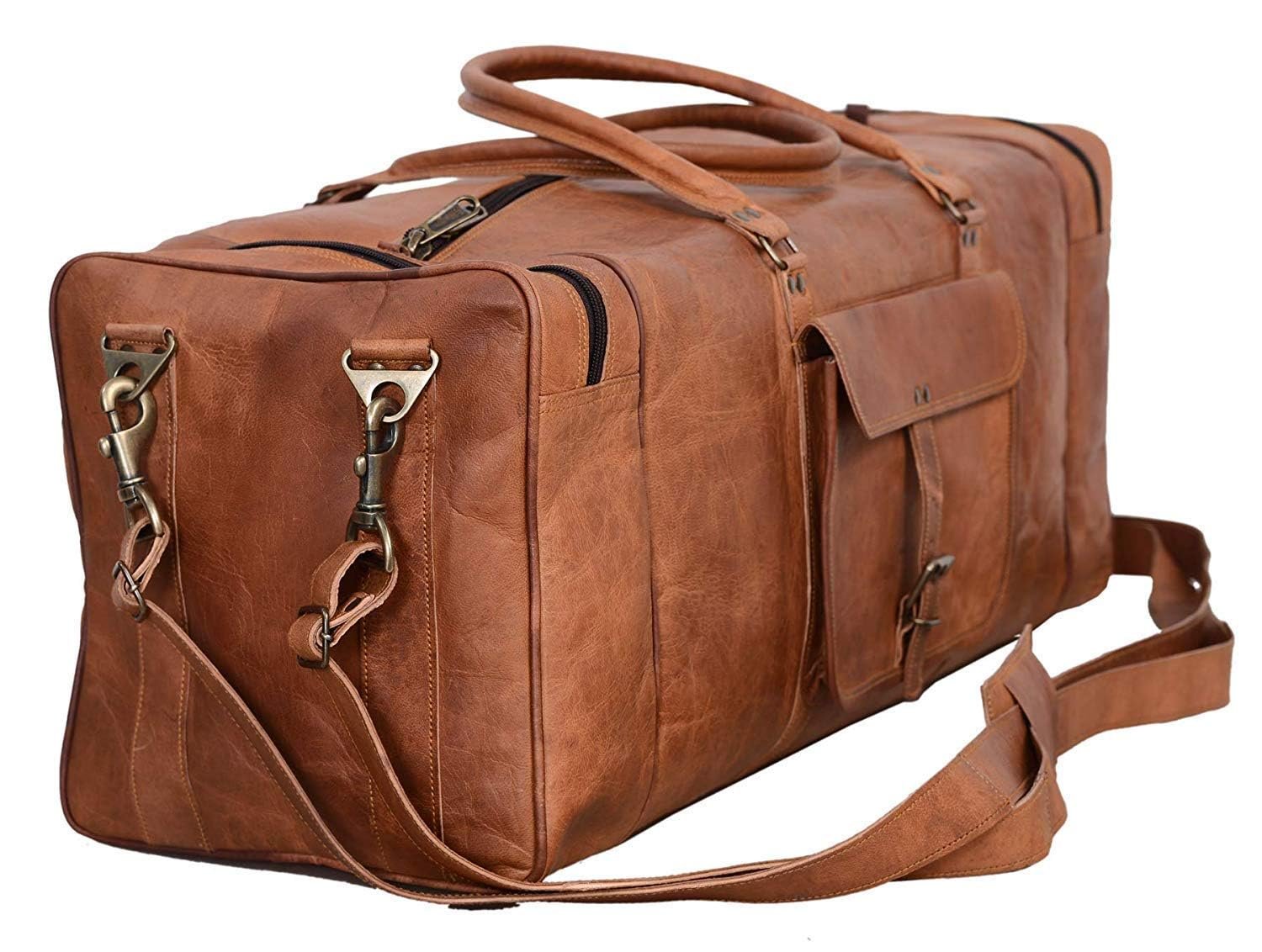 A vintage brown leather duffle bag with brass hardware, an adjustable shoulder strap, two top handles, and multiple zippered compartments.