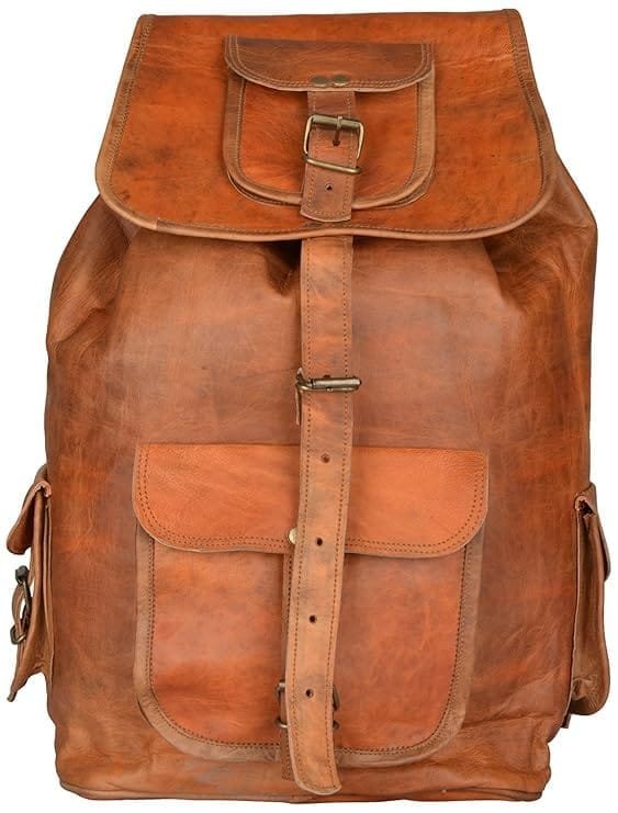 A vintage brown leather backpack with front pockets and brass buckles.